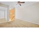 Hallway features carpet flooring with an orange accent wall and white trim at 557 Lawton Sw St, Atlanta, GA 30310
