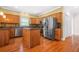 Kitchen with stainless steel appliances, island, and hardwood flooring at 557 Lawton Sw St, Atlanta, GA 30310