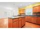 Kitchen with hardwood floors, center island, and adjacent breakfast area at 557 Lawton Sw St, Atlanta, GA 30310