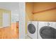 Laundry room featuring washer, dryer, and access to breakfast area at 557 Lawton Sw St, Atlanta, GA 30310