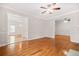 Elegant living room boasts hardwood floors, fireplace, and seamless flow to other living spaces at 557 Lawton Sw St, Atlanta, GA 30310