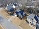 Aerial view of a charming home in a well-maintained suburban neighborhood at 690 Winding River Dr, Lawrenceville, GA 30046