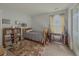 This bedroom has a twin bed, desk, bookshelf, and neutral walls at 690 Winding River Dr, Lawrenceville, GA 30046