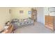 Cozy bedroom featuring a twin bed with bear quilt and wooden dresser at 690 Winding River Dr, Lawrenceville, GA 30046