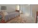 Comfortable bedroom showcasing a twin bed with storage underneath and a large closet at 690 Winding River Dr, Lawrenceville, GA 30046