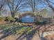 Stone community sign with flower beds that reads: Riveredge Landing at 690 Winding River Dr, Lawrenceville, GA 30046