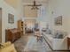 Inviting living room with high ceilings, lots of natural light, and an open layout flowing into the dining area at 690 Winding River Dr, Lawrenceville, GA 30046