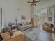 Comfortable living room featuring high ceilings, hardwood floors, and neutral tones at 690 Winding River Dr, Lawrenceville, GA 30046