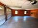 Spacious garage with roll up door, ample room for cars or storage, and paneled walls at 105 Doe Dr, Temple, GA 30179