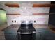 The kitchen boasts an oven, granite countertops, and unique backsplash tiling at 105 Doe Dr, Temple, GA 30179