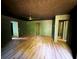 The living room boasts wood floors, neutral paint, and a view into a closet at 105 Doe Dr, Temple, GA 30179