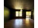 The living room features wood floors, neutral paint, and abundant light at 105 Doe Dr, Temple, GA 30179