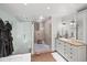 Bathroom with granite vanity, glass shower, and towel warmer at 1880 Redbourne Dr, Atlanta, GA 30350