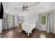 Bedroom with hardwood flooring, ceiling fan, and natural lighting at 1880 Redbourne Dr, Atlanta, GA 30350