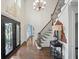 Stunning front entrance featuring wood floors, high ceilings, and an ornate iron door at 1880 Redbourne Dr, Atlanta, GA 30350