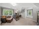 Large office area with ample sunlight, a leather sofa, and dedicated workstation at 1880 Redbourne Dr, Atlanta, GA 30350