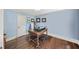 Cozy home office featuring hardwood floors, blue walls, and traditional furnishings at 1880 Redbourne Dr, Atlanta, GA 30350