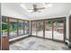 Sunroom with skylights and floor-to-ceiling windows overlooking stone patio at 1880 Redbourne Dr, Atlanta, GA 30350