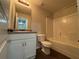 A full bathroom features a granite-look vanity, sink, toilet, and a tub and shower combo at 241 Coral Cir, Mcdonough, GA 30253