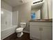Bright bathroom offers vanity, granite countertop, and a full-size tub with shower at 241 Coral Cir, Mcdonough, GA 30253