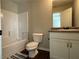 Bright bathroom features a shower-tub combination with a single sink vanity at 241 Coral Cir, Mcdonough, GA 30253