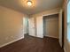 Well-lit bedroom with wood-look floors and a large closet with plenty of room for storage at 241 Coral Cir, Mcdonough, GA 30253