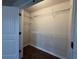 Walk-in closet with wooden floors and wire shelving at 241 Coral Cir, Mcdonough, GA 30253