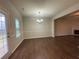 The dining room features wooden floors, a modern light fixture and an open-concept feel at 241 Coral Cir, Mcdonough, GA 30253