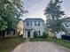 Exterior front view of a two-story home with a gray facade and a concrete driveway at 241 Coral Cir, Mcdonough, GA 30253