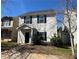 Inviting two-story home showcasing a cozy entrance, well-manicured bushes, and easy access to a sidewalk at 241 Coral Cir, Mcdonough, GA 30253