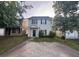 Charming two-story home featuring a paved driveway and well-maintained front yard, perfect for suburban living at 241 Coral Cir, Mcdonough, GA 30253