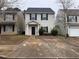 Well-maintained two-story home with a walkway leading to the front door at 241 Coral Cir, Mcdonough, GA 30253