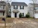 Inviting home featuring a well-maintained lawn and a private walkway to the front door at 241 Coral Cir, Mcdonough, GA 30253