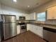 Well-equipped kitchen with stainless steel appliances, granite countertops, and plenty of cabinet space, perfect for cooking at 241 Coral Cir, Mcdonough, GA 30253