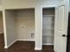 A laundry room features a closet with shelving, a washing machine hookup, and a dryer hookup at 241 Coral Cir, Mcdonough, GA 30253