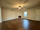 Welcoming living room featuring a fireplace and wood-look floors, perfect for relaxation at 241 Coral Cir, Mcdonough, GA 30253