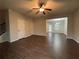 Spacious living area boasting wood-look floors and natural light from windows, offering a comfortable space at 241 Coral Cir, Mcdonough, GA 30253