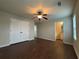 Generously sized bedroom with wooden floors, ceiling fan, and ensuite access at 241 Coral Cir, Mcdonough, GA 30253