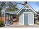 Charming back house with a shaded outdoor dining and seating area at 28 Peachtree Hills Ne Ave, Atlanta, GA 30305
