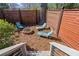 Backyard featuring an outdoor stone fire pit and privacy fencing at 28 Peachtree Hills Ne Ave, Atlanta, GA 30305