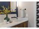 Modern bathroom with stylish marble countertop, vessel sink, and black faucet, complemented by artistic wallpaper at 28 Peachtree Hills Ne Ave, Atlanta, GA 30305