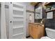 Elegant bathroom featuring a modern vanity, stylish mirror, and tiled walls at 28 Peachtree Hills Ne Ave, Atlanta, GA 30305