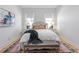 Inviting bedroom featuring hardwood floors, a comfortable bed, and lots of natural light at 28 Peachtree Hills Ne Ave, Atlanta, GA 30305