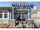 Inviting front porch with a pergola, seating area, and stylish house number display at 28 Peachtree Hills Ne Ave, Atlanta, GA 30305