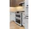 Gas range double oven and custom cabinetry with modern hardware at 28 Peachtree Hills Ne Ave, Atlanta, GA 30305