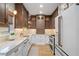 Modern kitchen featuring a white refrigerator, stainless steel appliances, and granite countertops at 28 Peachtree Hills Ne Ave, Atlanta, GA 30305