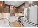 Stylish kitchen features custom cabinets, stainless steel appliances, and granite countertops at 28 Peachtree Hills Ne Ave, Atlanta, GA 30305