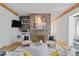 Living room showcases a stone fireplace, built-in shelves, and comfortable seating at 28 Peachtree Hills Ne Ave, Atlanta, GA 30305