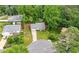 Charming single-story home nestled in a lush, green landscape with mature trees and a well-maintained front lawn at 4934 Woodstream Nw Ln, Acworth, GA 30102