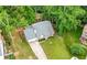 An aerial view shows this cozy home's backyard privacy and the surrounding mature tree coverage at 4934 Woodstream Nw Ln, Acworth, GA 30102